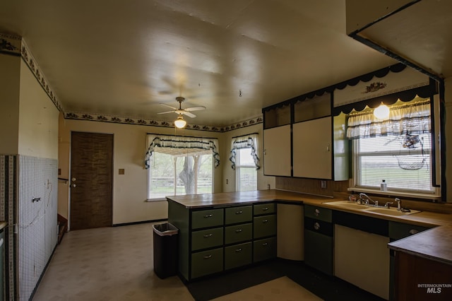 8970 Hurd Ln With 7, Acres, Payette, ID 83661 - kitchen featuring a peninsula, ceiling fan, a sink, and dark countertops