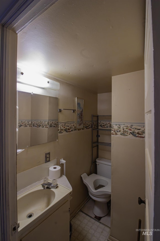 8970 Hurd Ln With 7, Acres, Payette, ID 83661 - half bathroom featuring toilet, tile patterned floors, and vanity