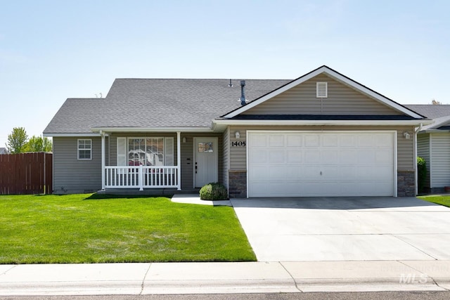 ranch-style house with covered porch, fence, concrete driveway, a garage, and a front lawn
