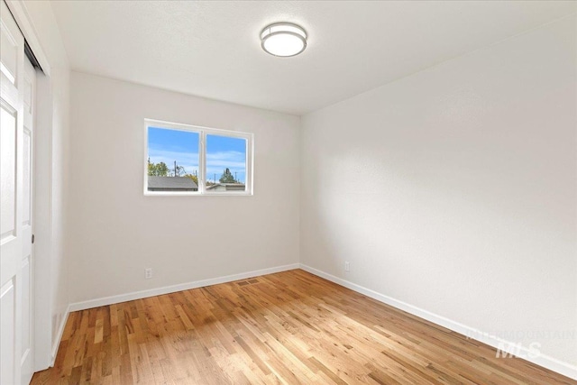 unfurnished room featuring light hardwood / wood-style flooring