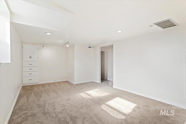 empty room with light colored carpet