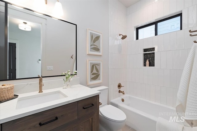 bathroom with toilet, bathtub / shower combination, and vanity