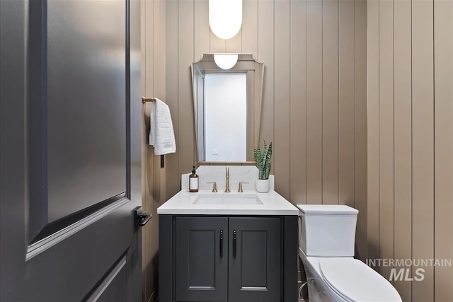 bathroom featuring toilet and vanity
