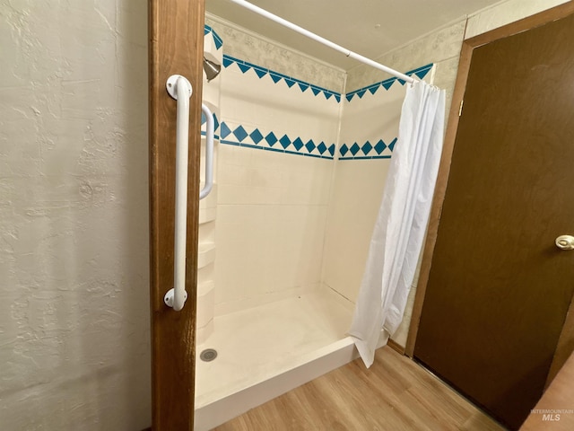 2934 SW Smith Rd, Mountain Home, ID 83647 - bathroom with wood-type flooring and a shower with curtain