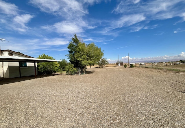 2934 SW Smith Rd, Mountain Home, ID 83647 - view of yard featuring a carport and a rural view