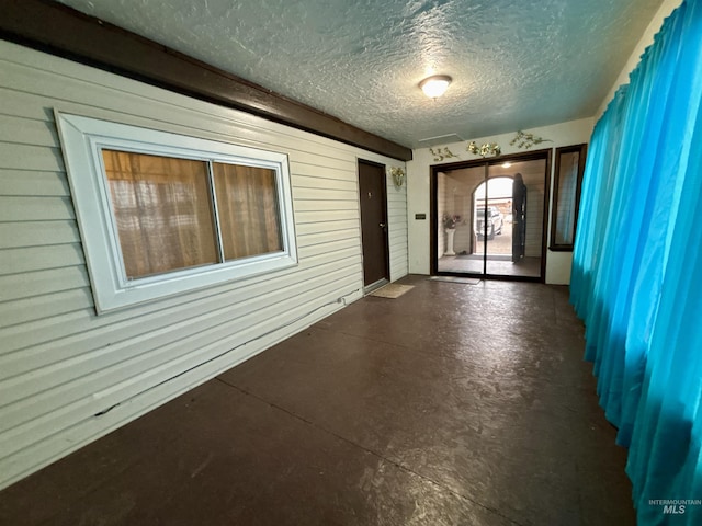 2934 SW Smith Rd, Mountain Home, ID 83647 - interior space featuring wooden walls and a textured ceiling