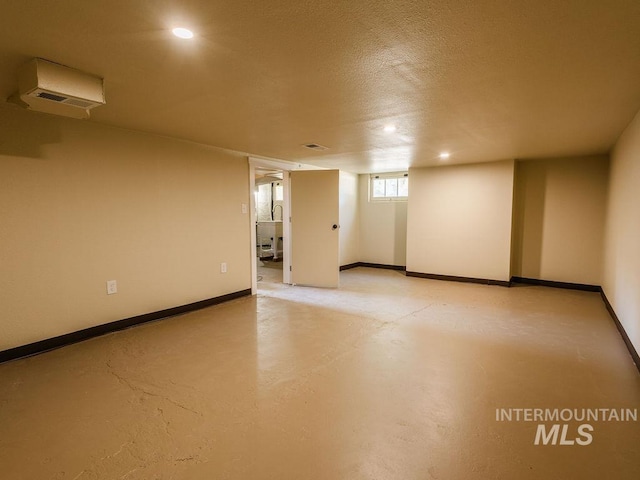below grade area featuring recessed lighting and baseboards