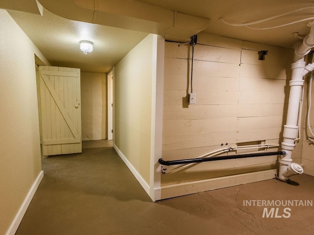 unfinished below grade area featuring baseboards