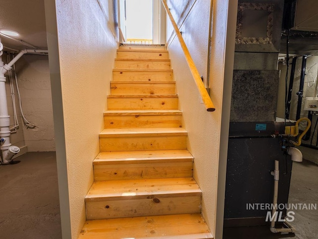 stairway with a textured wall
