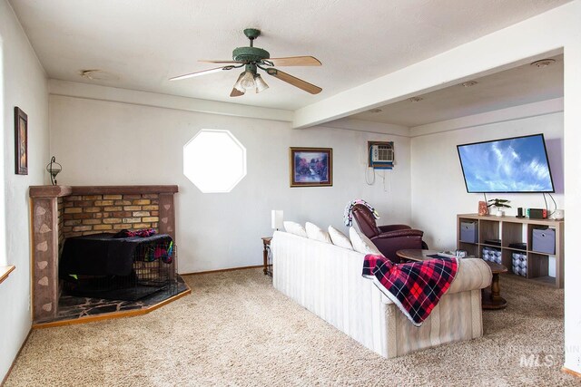 134 Maple Ave, Hansen, ID 83334 - carpeted living area featuring ceiling fan, beamed ceiling, baseboards, and a wall mounted AC