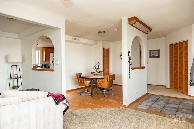 134 Maple Ave, Hansen, ID 83334 - living room featuring wood finished floors, baseboards, and arched walkways