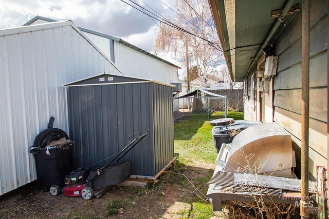 134 Maple Ave, Hansen, ID 83334 - view of yard with fence, a shed, and an outbuilding