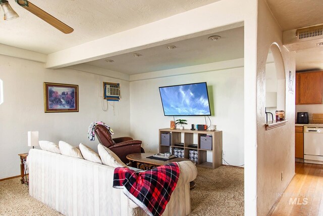 134 Maple Ave, Hansen, ID 83334 - living area featuring beamed ceiling, baseboards, ceiling fan, and a wall mounted AC