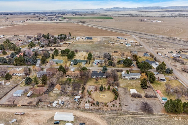 drone / aerial view with a mountain view and a rural view