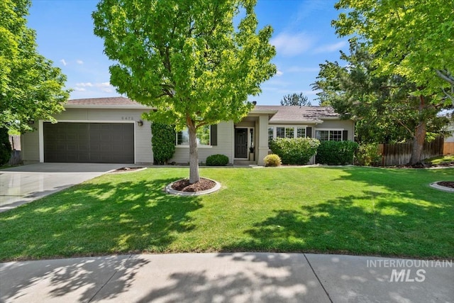 6472 S Liveoak Pl, Boise, ID 83716 - ranch-style house featuring an attached garage and driveway