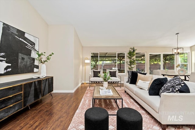 6472 S Liveoak Pl, Boise, ID 83716 - living area featuring wood finished floors, baseboards, and a chandelier