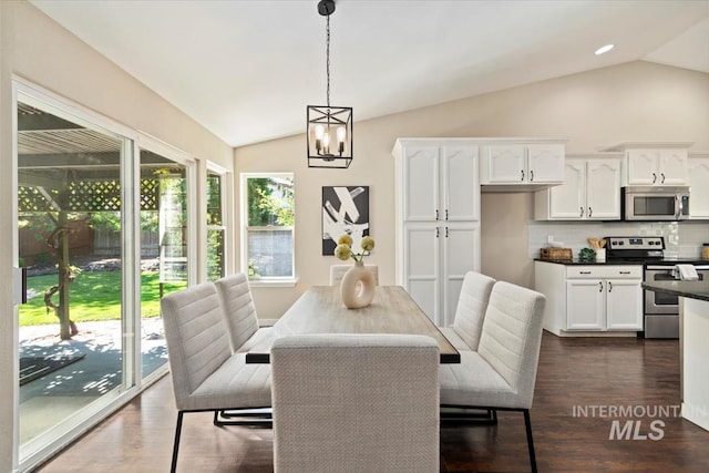 6472 S Liveoak Pl, Boise, ID 83716 - dining room featuring vaulted ceiling, dark wood finished floors, and a chandelier