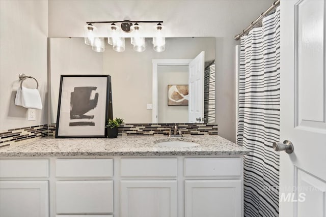 6472 S Liveoak Pl, Boise, ID 83716 - bathroom with decorative backsplash and double vanity