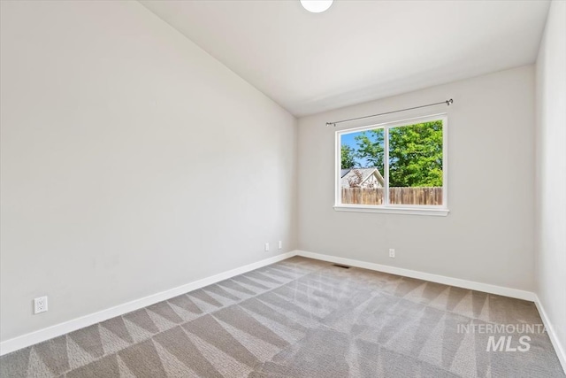 6472 S Liveoak Pl, Boise, ID 83716 - empty room with carpet, vaulted ceiling, and baseboards