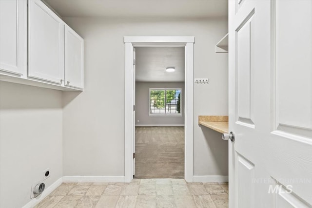 6472 S Liveoak Pl, Boise, ID 83716 - laundry room with hookup for an electric dryer, baseboards, cabinet space, and light colored carpet