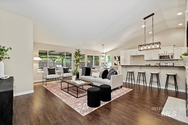 6472 S Liveoak Pl, Boise, ID 83716 - living area featuring lofted ceiling, dark wood-style floors, plenty of natural light, baseboards, and recessed lighting