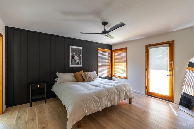 12281 W Norway St, Boise, ID 83713 - bedroom featuring multiple windows, light wood-style floors, and baseboards