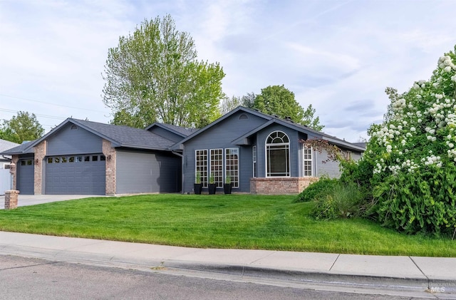 12281 W Norway St, Boise, ID 83713 - ranch-style house with an attached garage, brick siding, a front yard, and concrete driveway