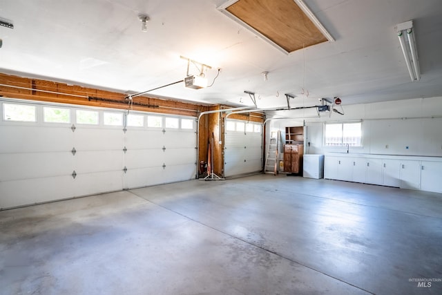 12281 W Norway St, Boise, ID 83713 - garage featuring a garage door opener and a sink
