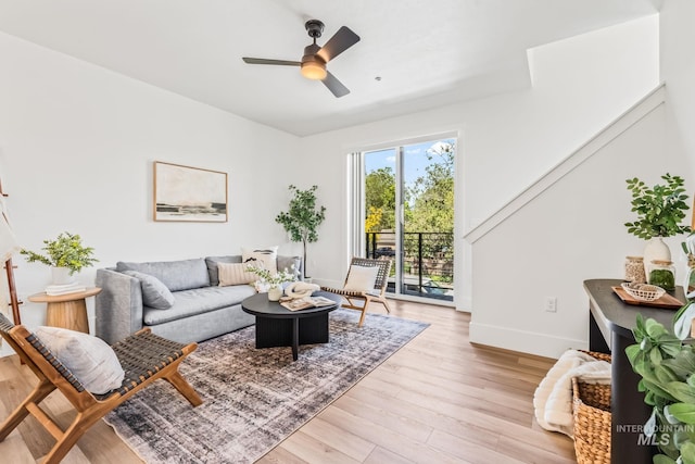 2919 W Jordan Unit 2, Boise, ID 83702 - living room with baseboards, light wood-style flooring, and a ceiling fan