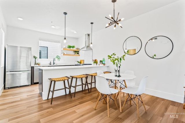 2919 W Jordan Unit 2, Boise, ID 83702 - dining space featuring light wood-type flooring, baseboards, a chandelier, and recessed lighting