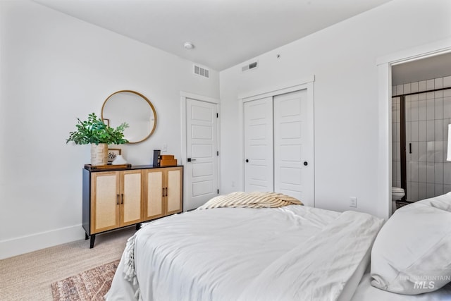 2919 W Jordan Unit 2, Boise, ID 83702 - carpeted bedroom featuring a closet, baseboards, and ensuite bathroom