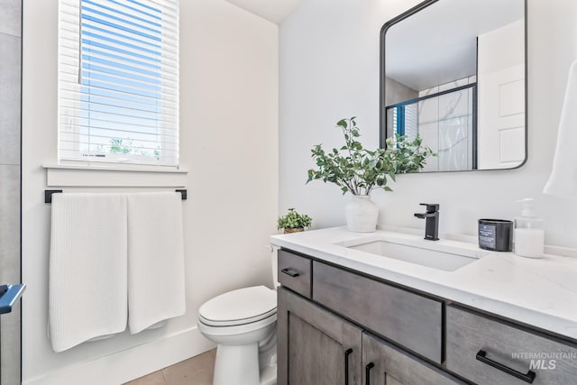 2919 W Jordan Unit 2, Boise, ID 83702 - full bathroom featuring vanity, a shower with door, tile patterned flooring, and toilet