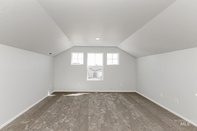 309 Gold Nugget Ave, Caldwell, ID 83605 - additional living space with vaulted ceiling, visible vents, carpet floors, and baseboards