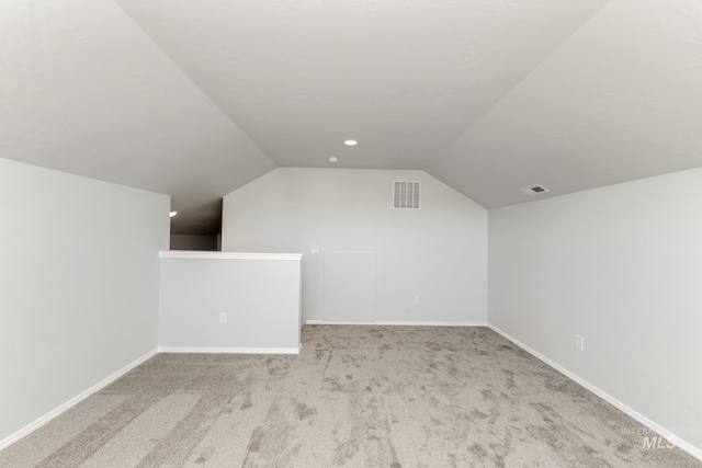 309 Gold Nugget Ave, Caldwell, ID 83605 - additional living space featuring baseboards, lofted ceiling, visible vents, and carpet
