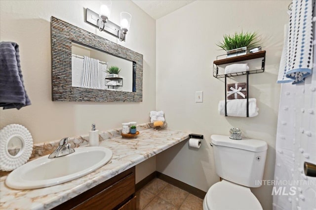 406 N Pine St, Emmett, ID 83617 - bathroom with vanity, toilet, tile patterned flooring, baseboards, and curtained shower