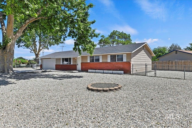 406 N Pine St, Emmett, ID 83617 - single story home featuring a garage, brick siding, and driveway