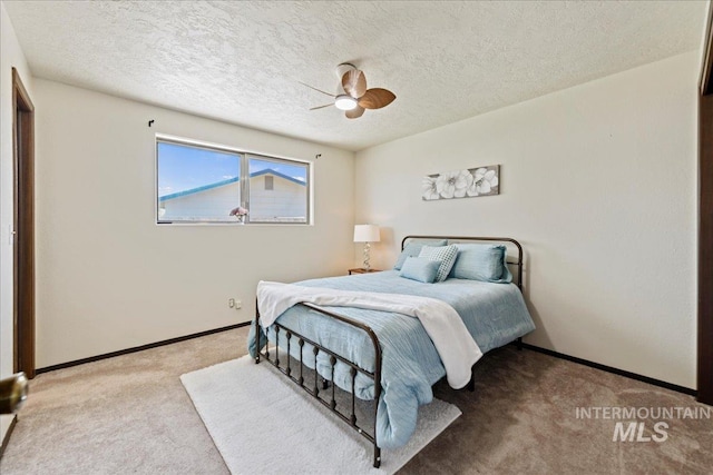 406 N Pine St, Emmett, ID 83617 - bedroom featuring carpet floors, a textured ceiling, baseboards, and a ceiling fan