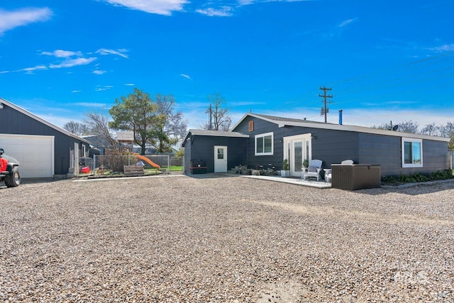 back of property featuring a garage