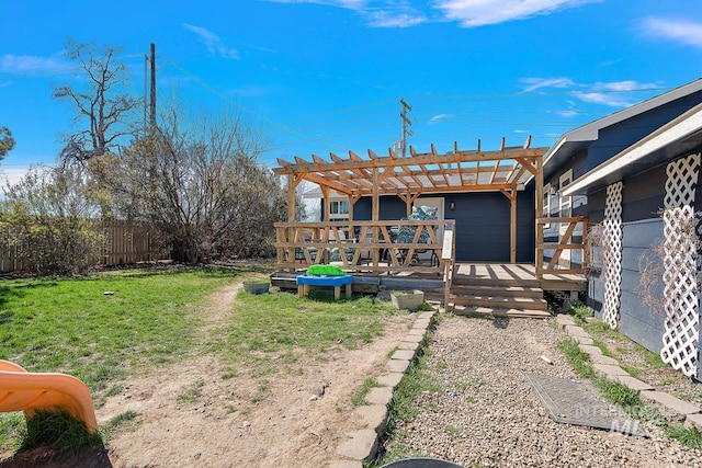 view of yard with a pergola and a wooden deck