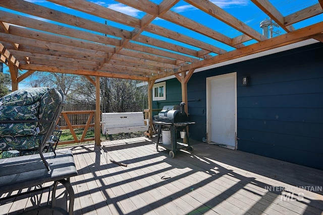 wooden deck featuring a pergola and grilling area