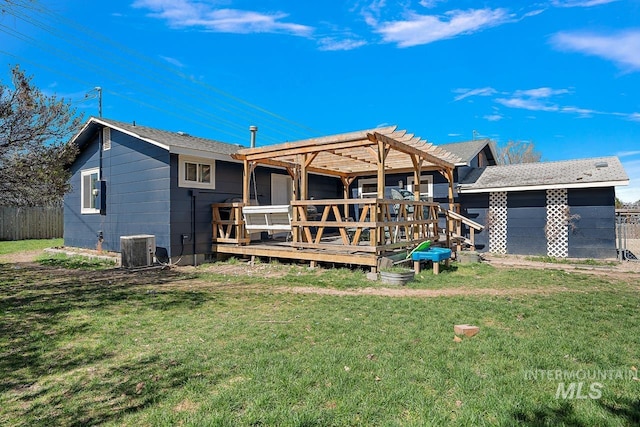 rear view of house featuring a yard, a pergola, central AC, and a deck