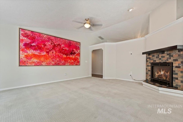 1825 E Seaside Ct, Boise, ID 83706 - unfurnished living room with vaulted ceiling, ceiling fan, a warm lit fireplace, carpet floors, and baseboards