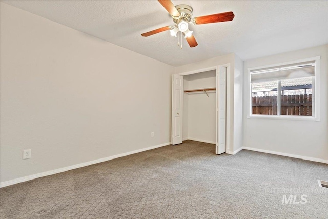 1825 E Seaside Ct, Boise, ID 83706 - unfurnished bedroom featuring carpet, a textured ceiling, baseboards, a closet, and a ceiling fan