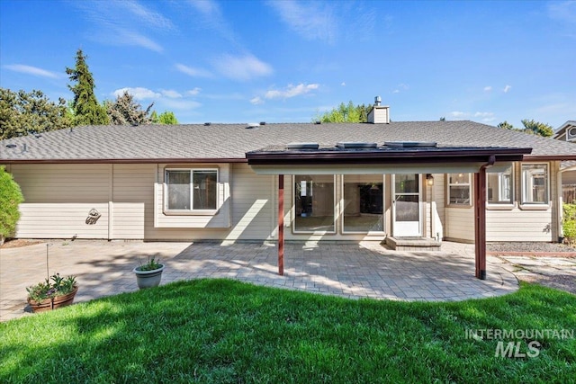 1825 E Seaside Ct, Boise, ID 83706 - back of property featuring a patio area, a chimney, and a lawn