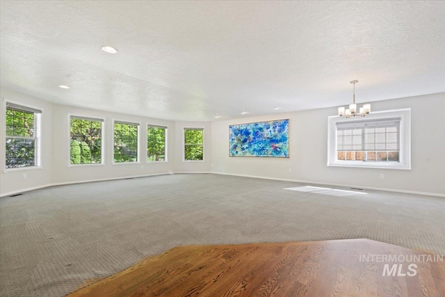 1825 E Seaside Ct, Boise, ID 83706 - carpeted empty room with a chandelier, baseboards, healthy amount of natural light, and recessed lighting