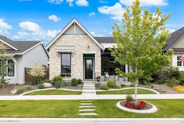 11684 N 23rd Ave, Boise, ID 83714 - view of front of house featuring stone siding, a standing seam roof, and metal roof