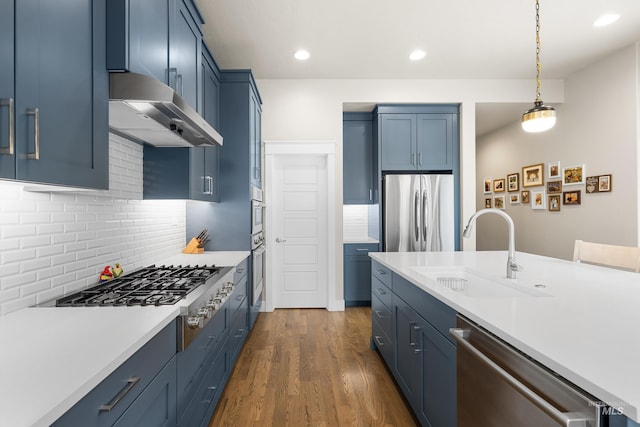 11684 N 23rd Ave, Boise, ID 83714 - kitchen featuring appliances with stainless steel finishes, a sink, blue cabinetry, light countertops, and recessed lighting