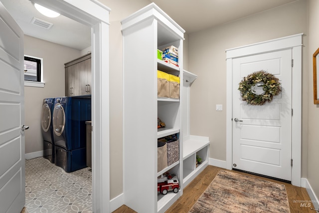 11684 N 23rd Ave, Boise, ID 83714 - mudroom featuring washing machine and clothes dryer, baseboards, and wood finished floors