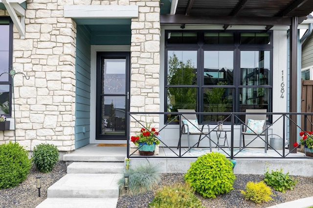 11684 N 23rd Ave, Boise, ID 83714 - property entrance featuring covered porch and stone siding