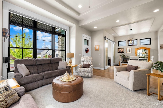 11684 N 23rd Ave, Boise, ID 83714 - carpeted living room featuring a barn door, recessed lighting, and baseboards